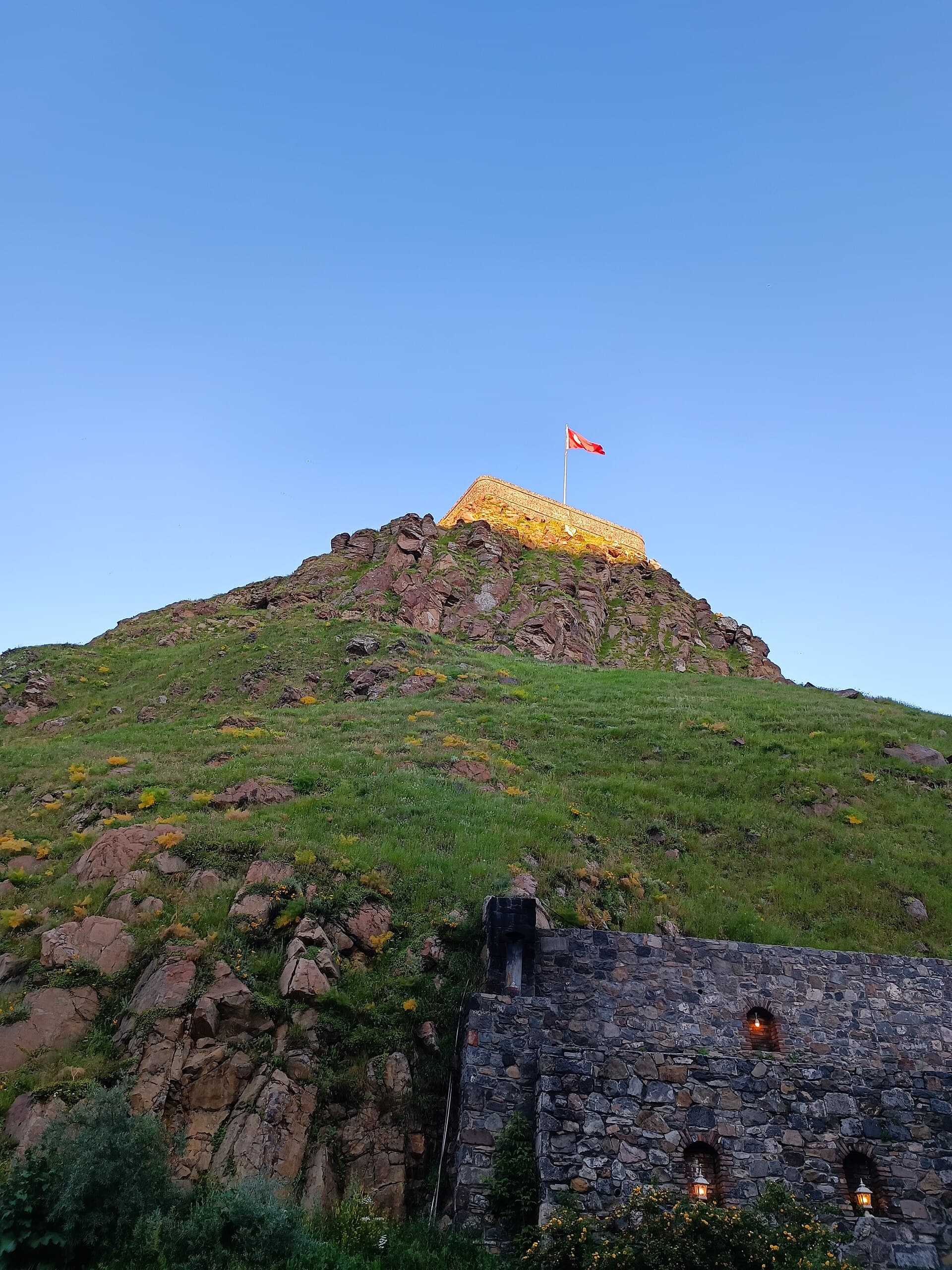 Daytime view of Kars Castle on its hilltop above the city.