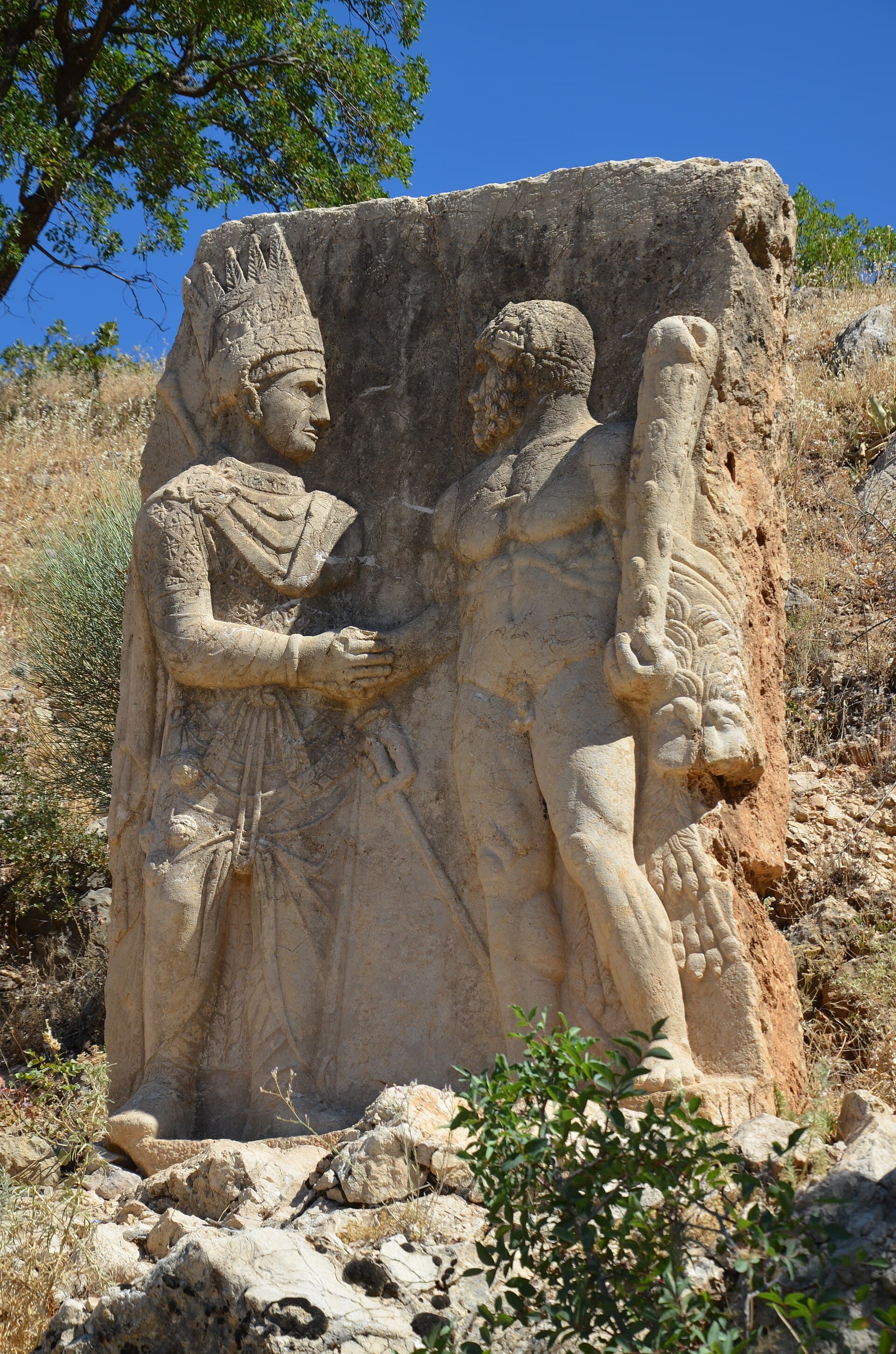 Rock-cut relief of a king clasping hands with the nude god Herakles at Arsameia