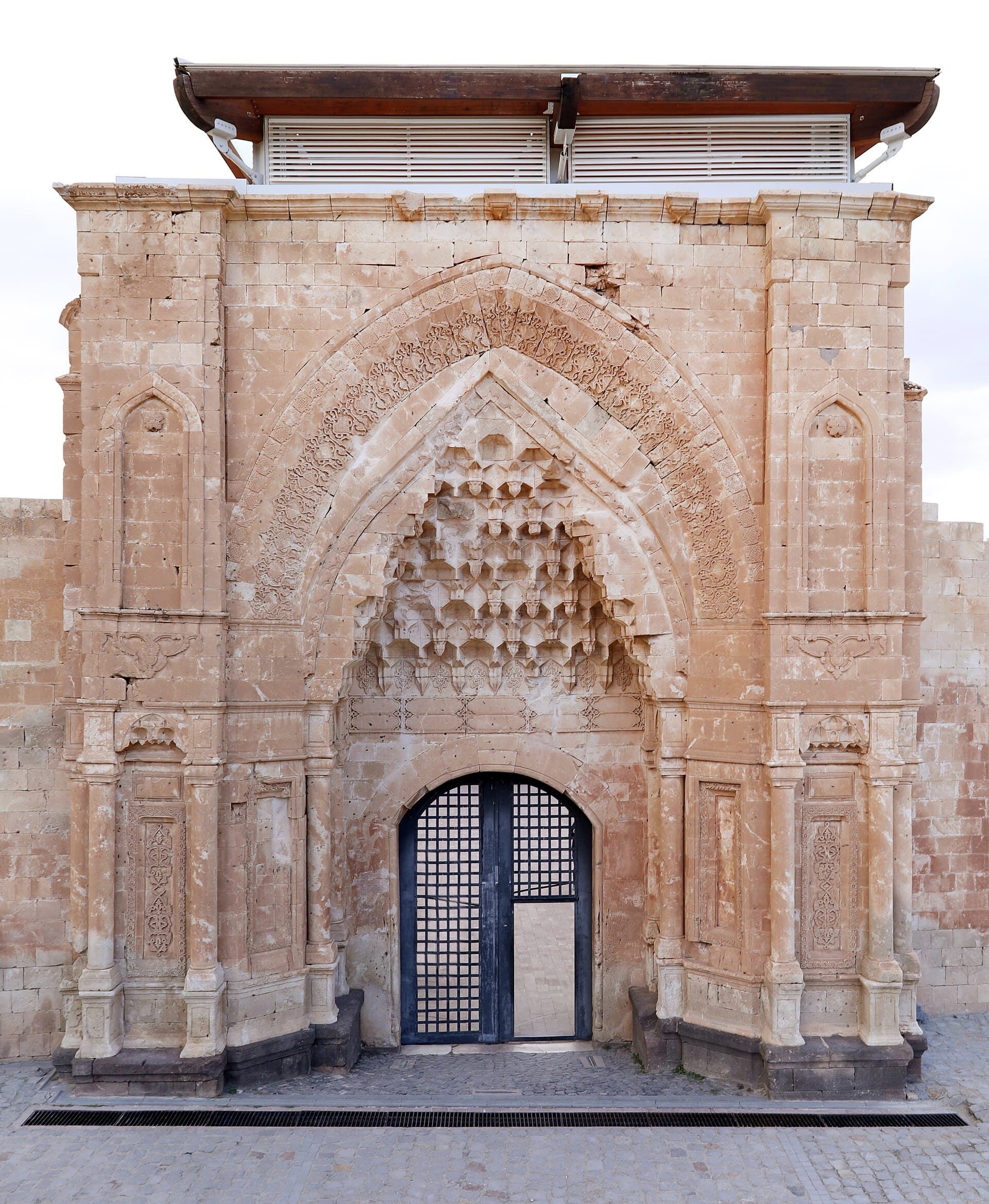 Carved stone entrance portal at İshak Paşa Palace's main courtyard facade