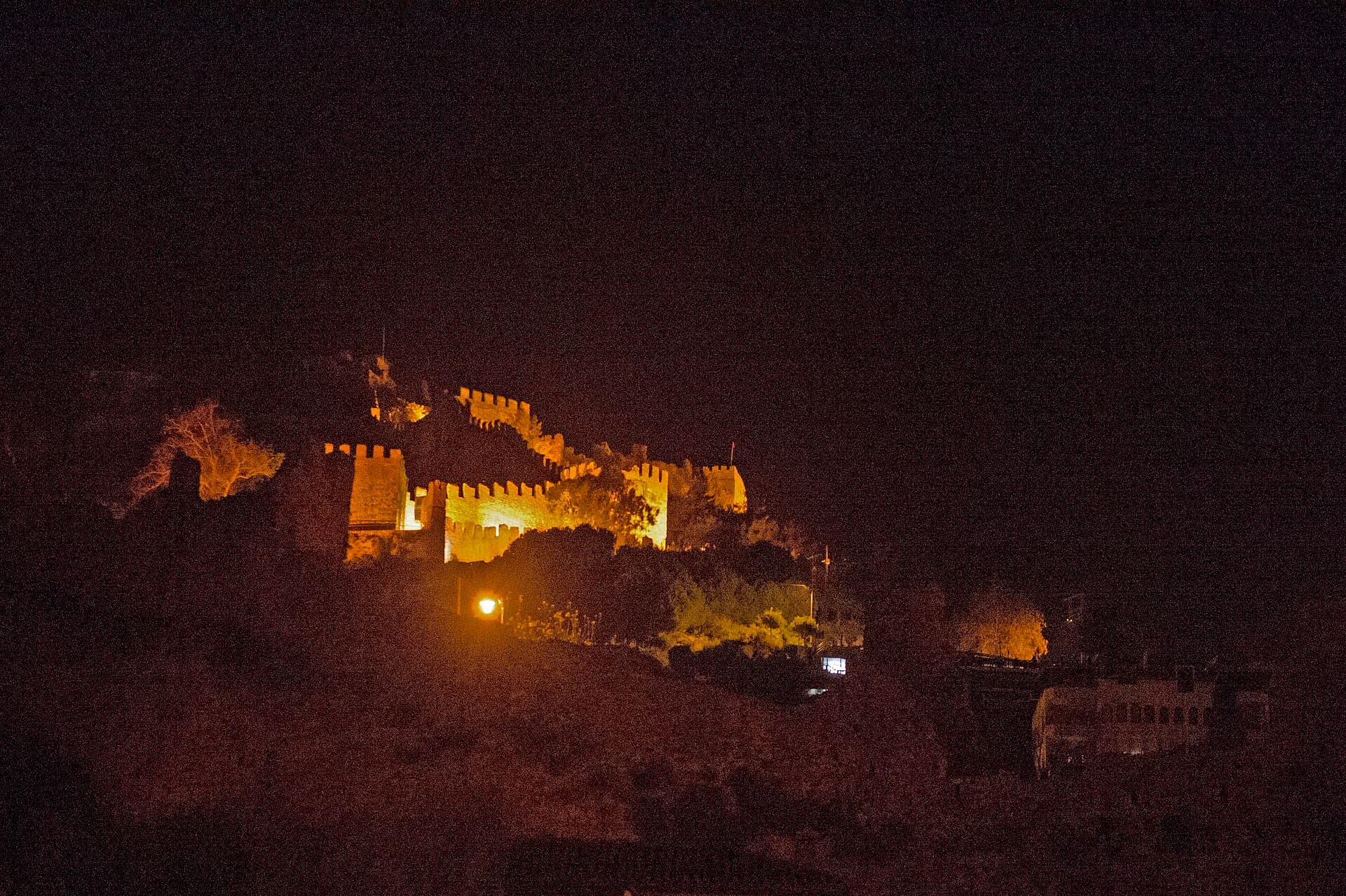 Alanya Castle's fortress walls on the hilltop peninsula, seen from near the Red Tower.