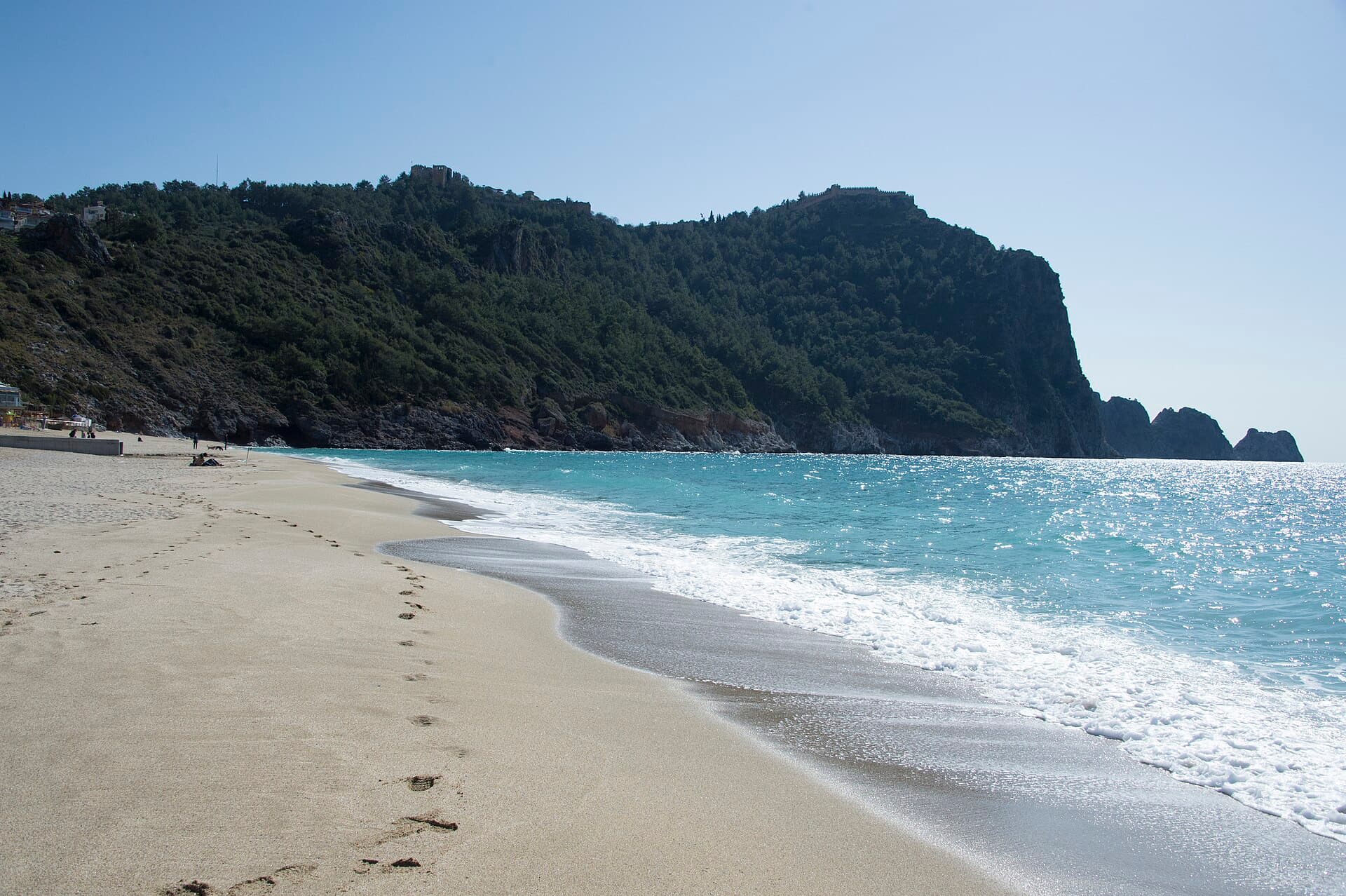 Cleopatra Beach with Alanya Castle's walls visible above the shoreline.