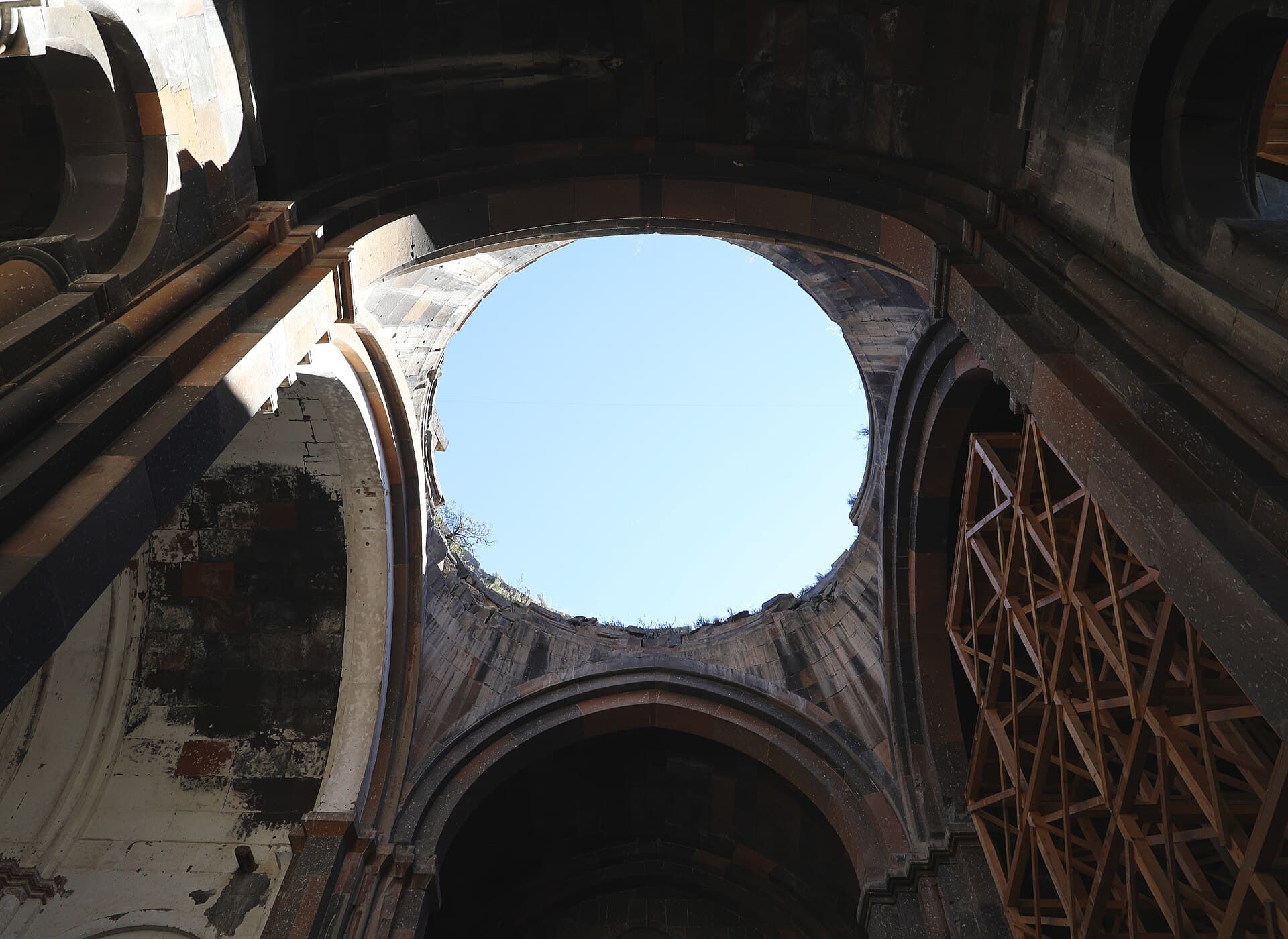 Looking up through the cathedral's collapsed dome to open blue sky