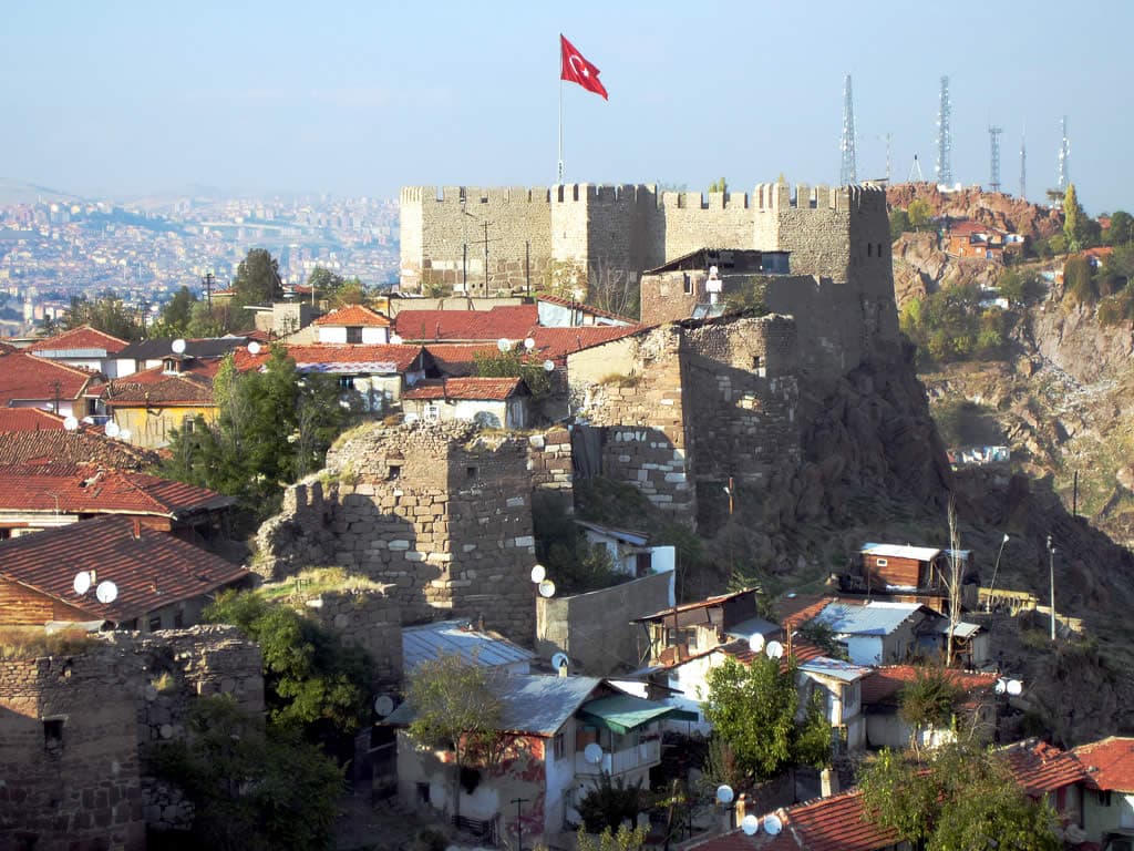High stone walls of Ankara Castle's citadel rising on the hill.