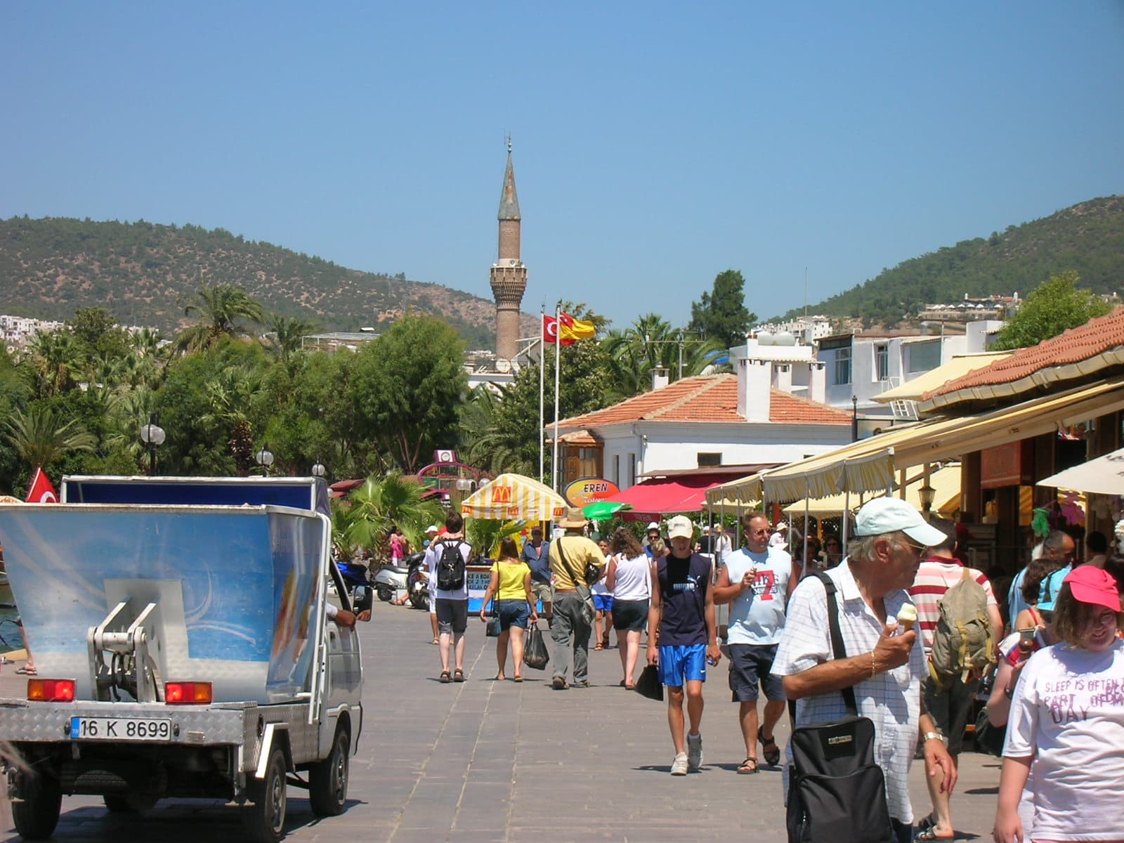 A busy boulevard through Bodrum's old town lined with shops and cafés.