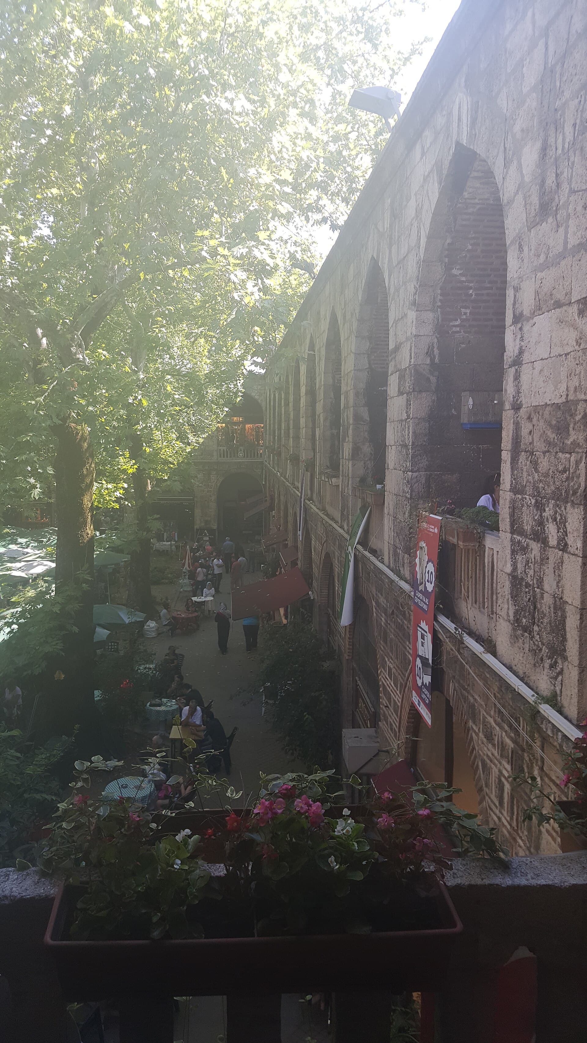 Arched two-storey stone arcade and gallery inside Koza Han, Bursa.