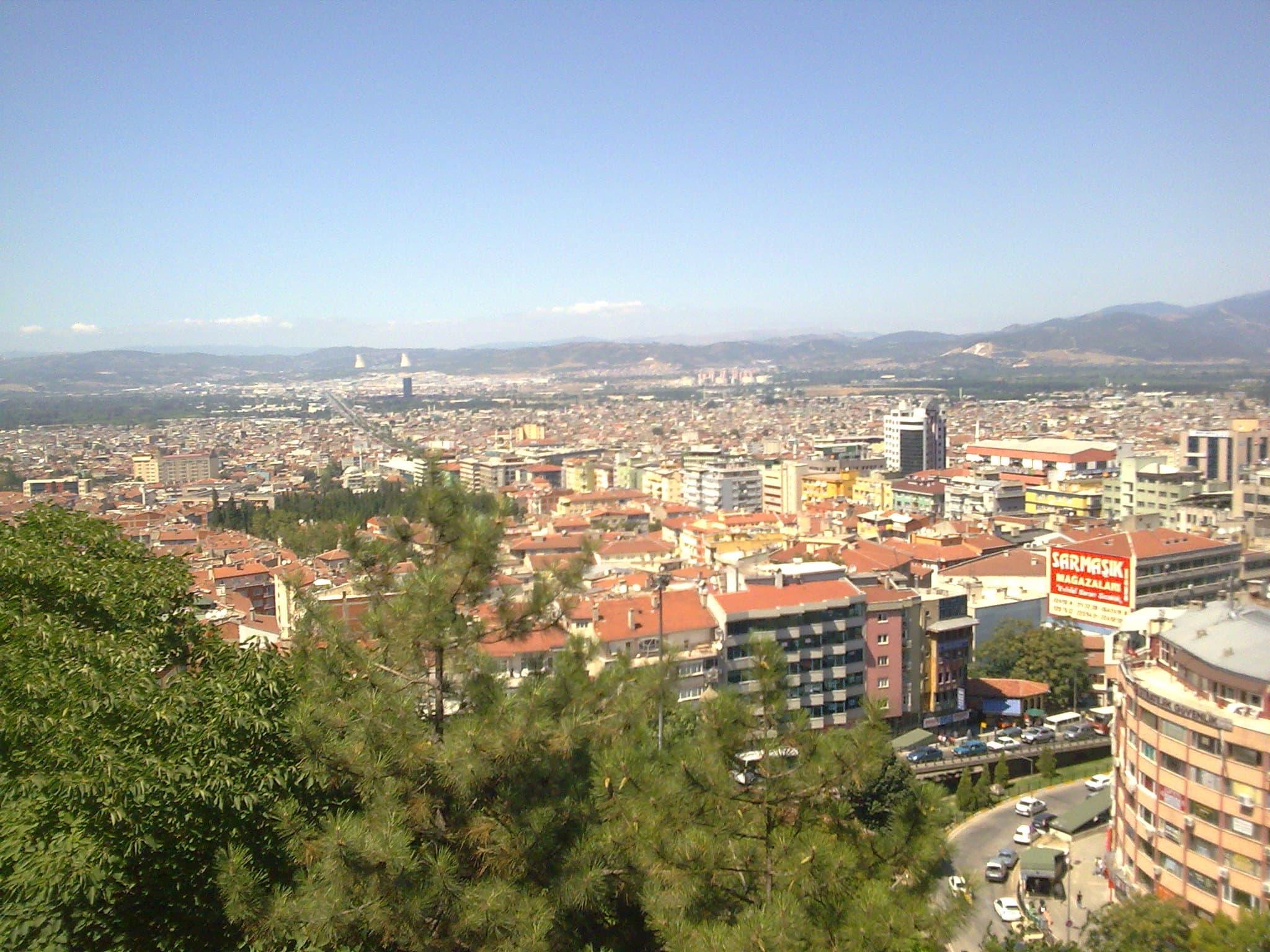 Panoramic view over Bursa city from Tophane hill on a sunny afternoon.