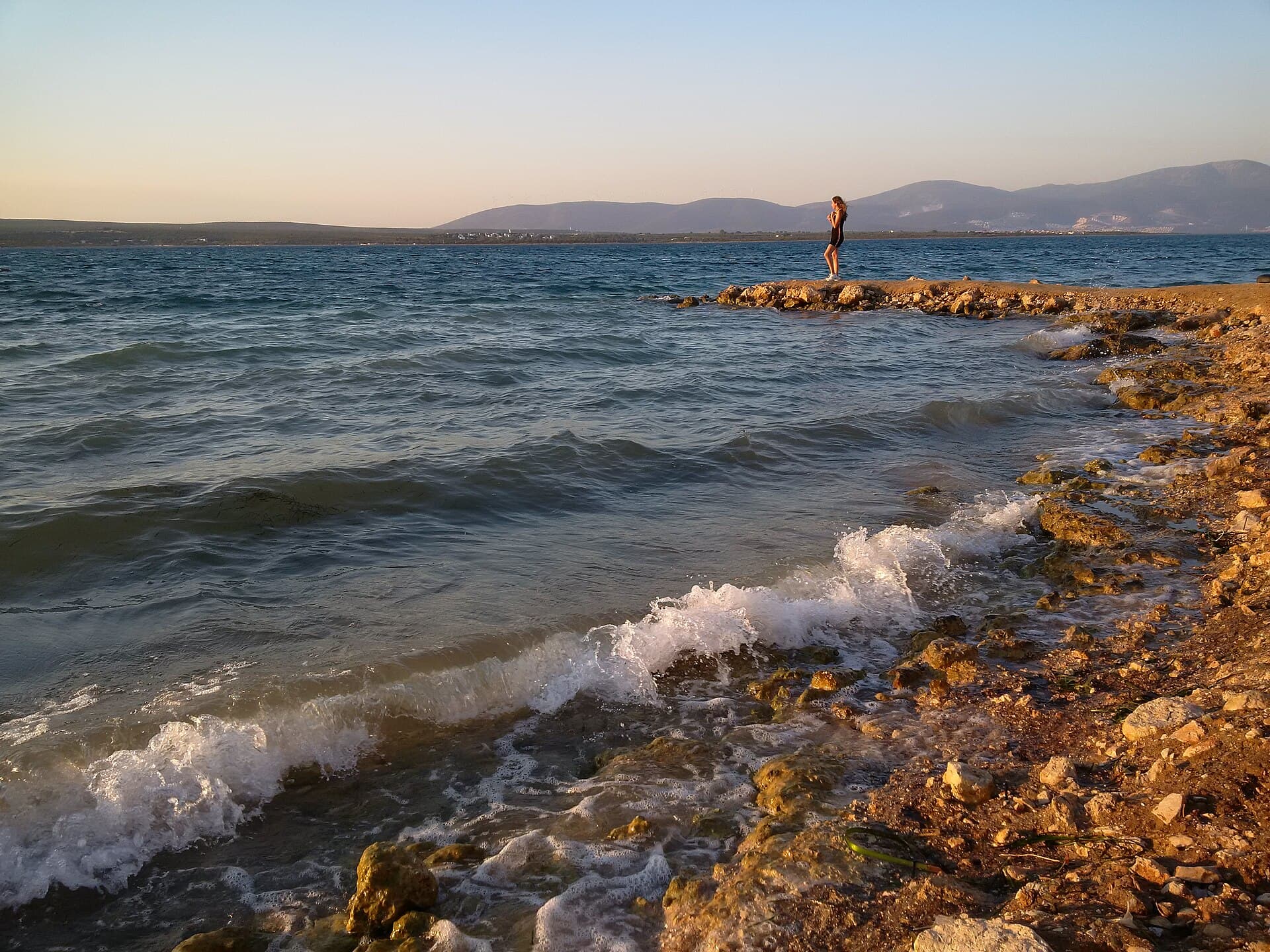 Summer shoreline view of golden sand at Altınkum beach, Didim.