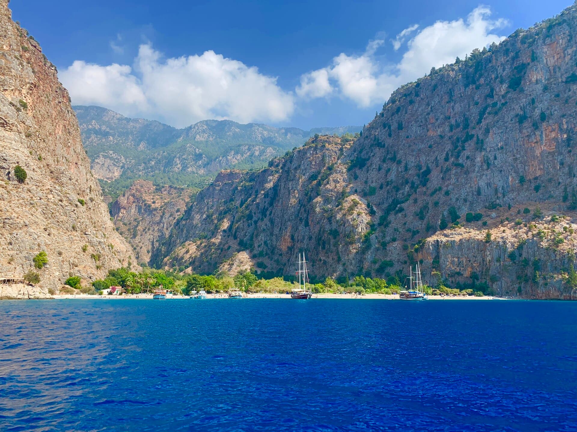 Elevated view of Butterfly Valley's steep cliffs and secluded beach near Fethiye