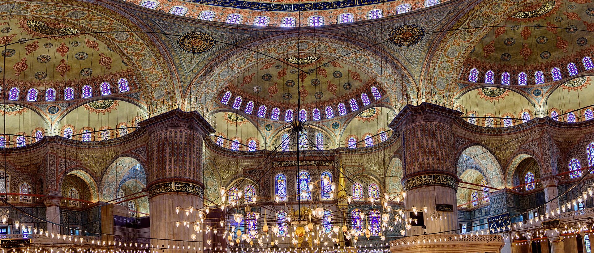 Painted domes, arches, and İznik tilework inside the Blue Mosque, Istanbul