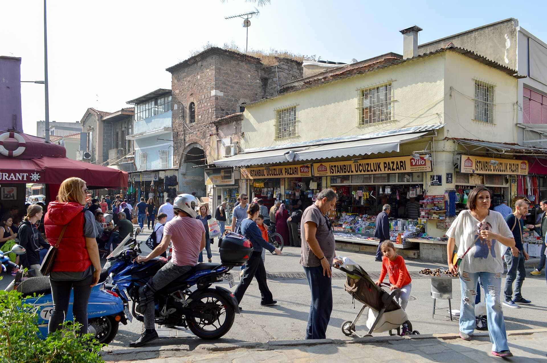 Bustling covered lane of Kemeraltı Bazaar lined with shop stalls, İzmir.