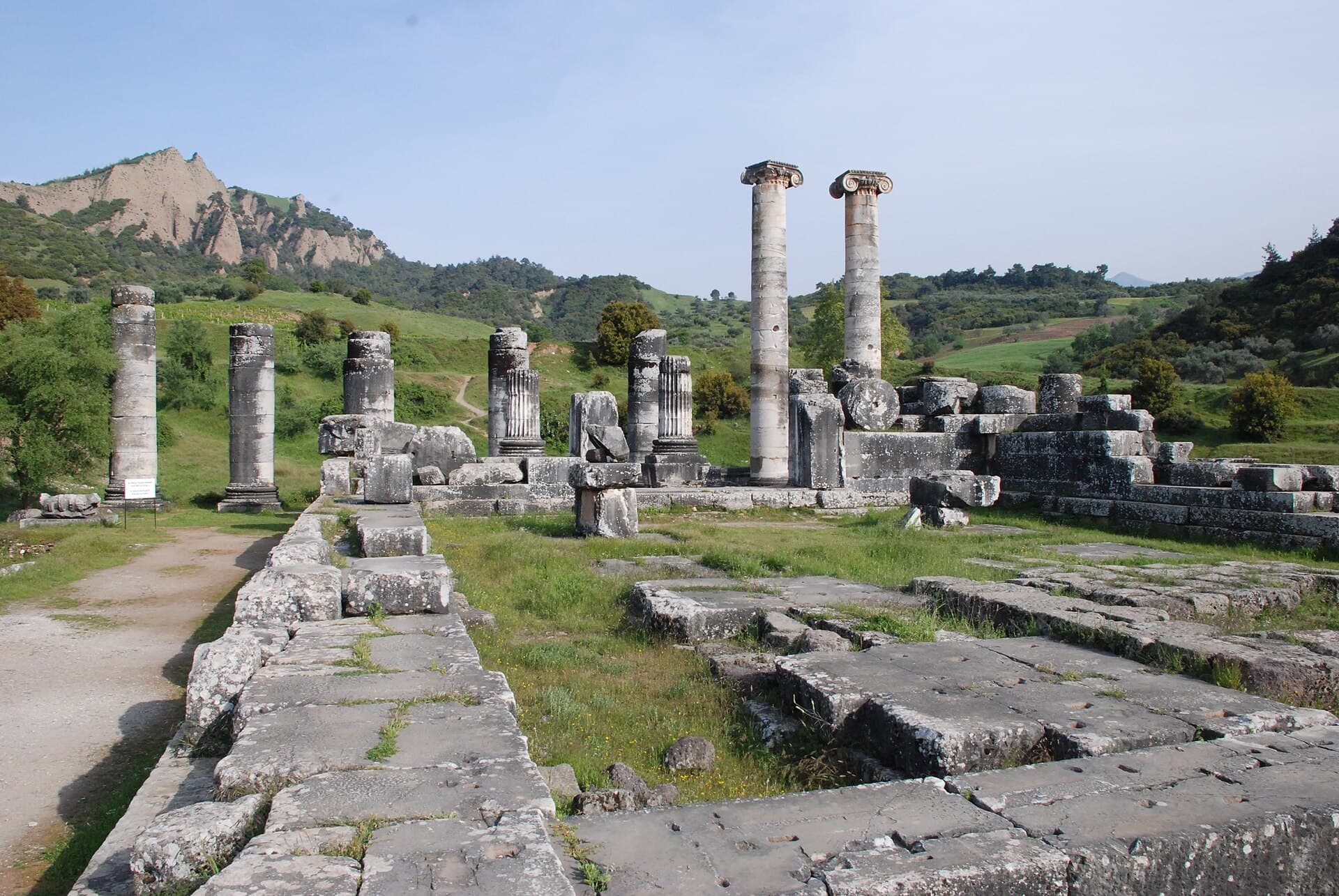 Two towering unrestored Ionic columns of the Temple of Artemis, Sardis.