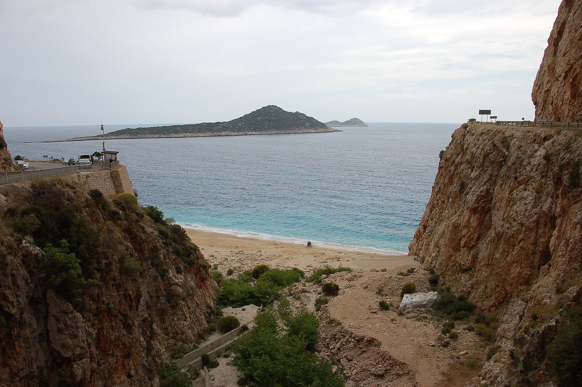 Turquoise cove and cliffs of Kaputaş Beach seen from the road bridge above.