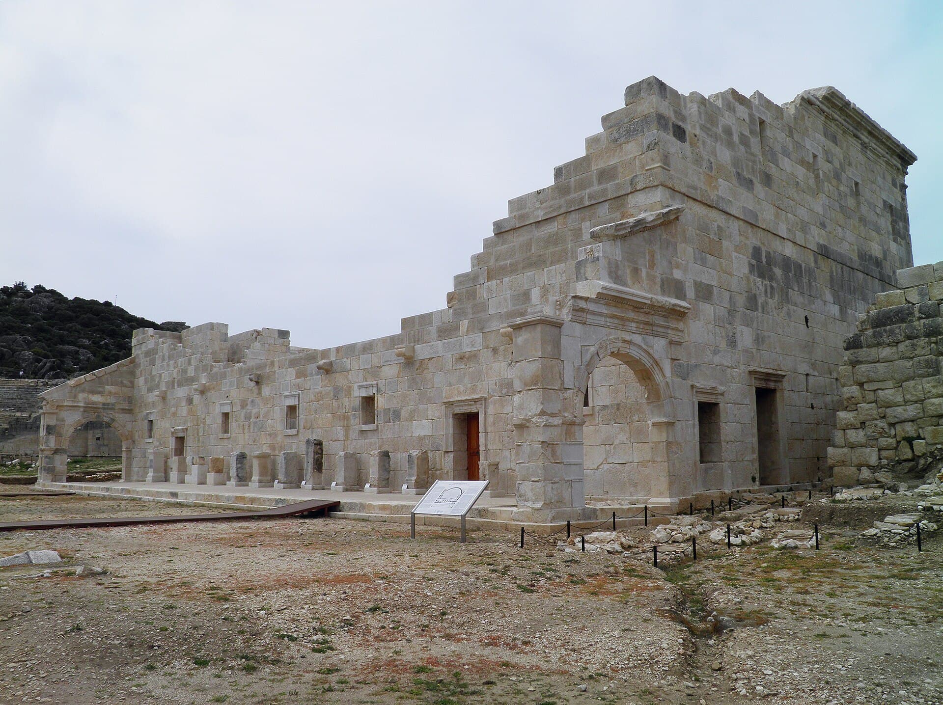 Sunlit restored semicircular bouleuterion, the Lycian League's ancient assembly hall in Patara.