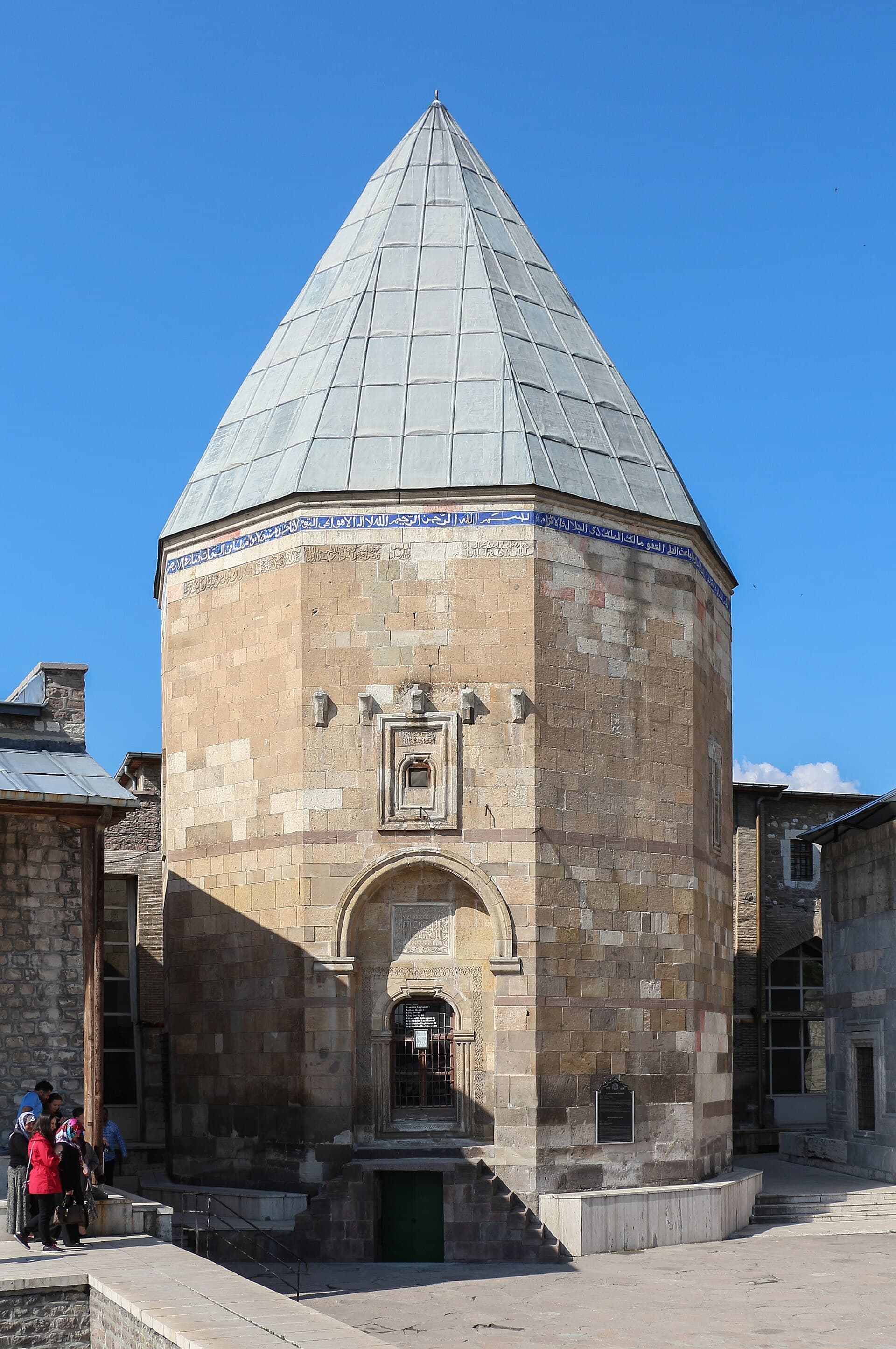 Conical stone-roofed kümbet of Sultan Kılıçarslan II in the mosque courtyard.