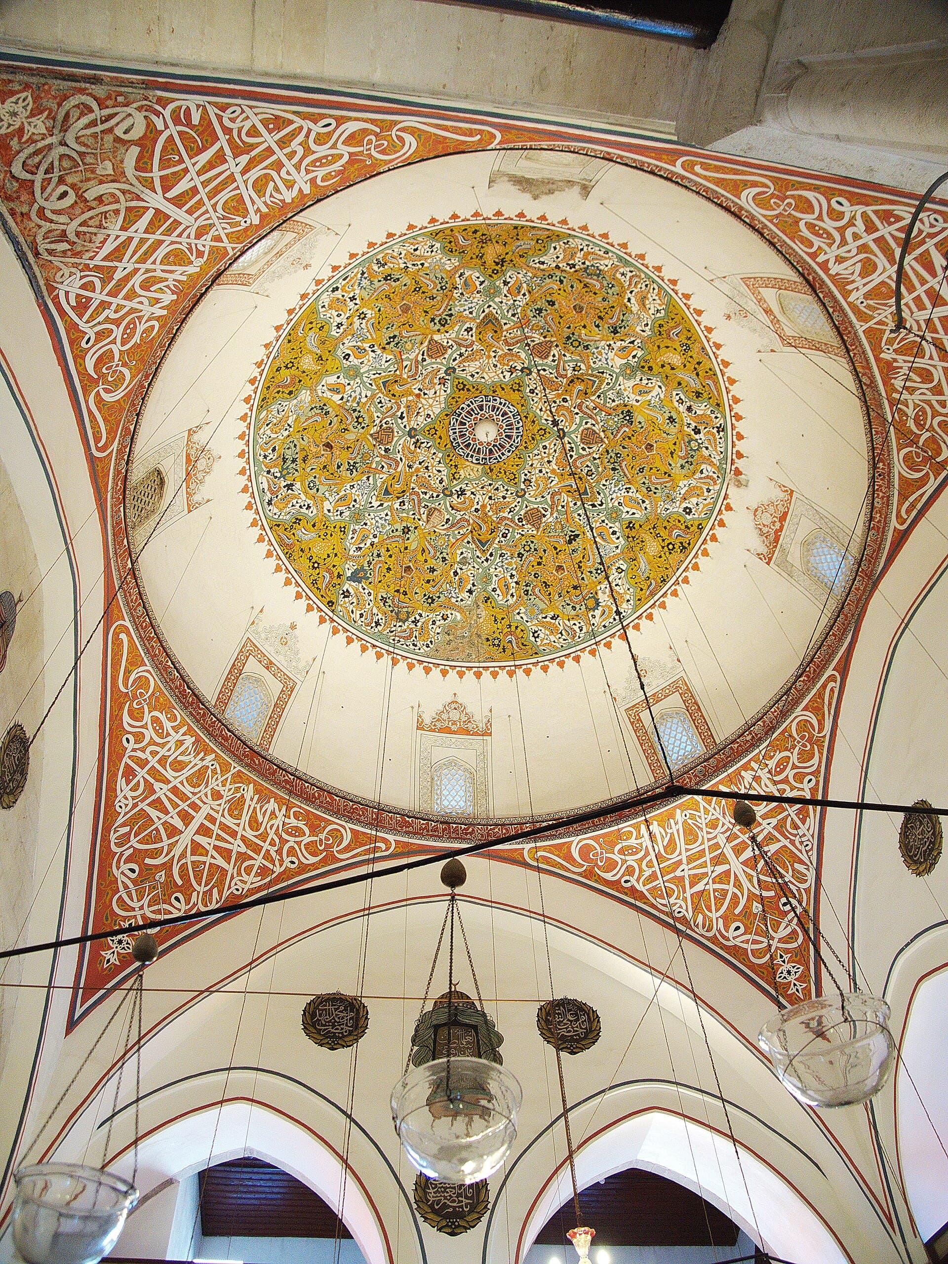 Turquoise fluted dome of Rumi's mausoleum rising above the Mevlana Museum in Konya.
