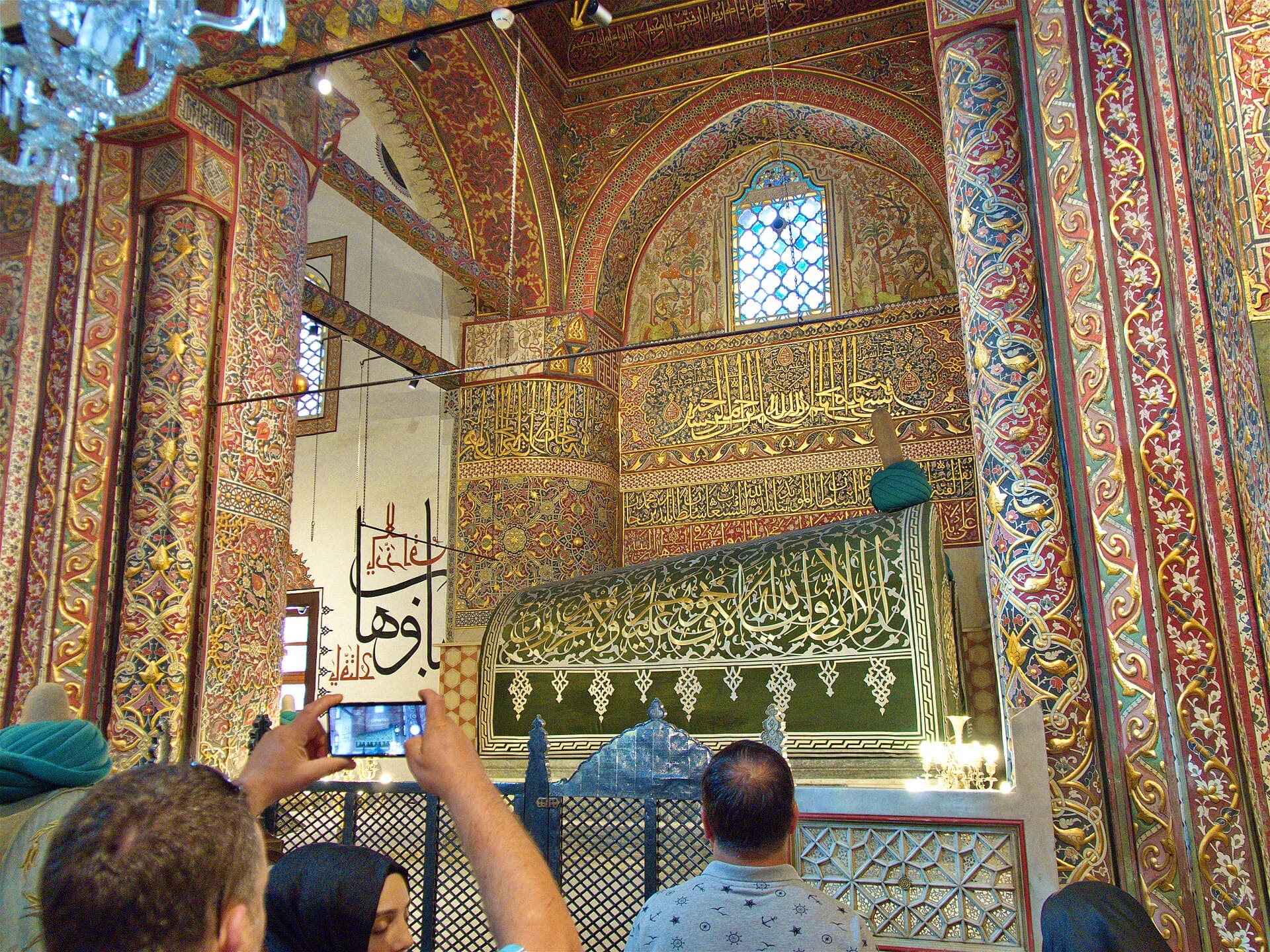 Rumi's cloth-draped sarcophagus with wound turban inside the Mevlana Mausoleum, Konya.