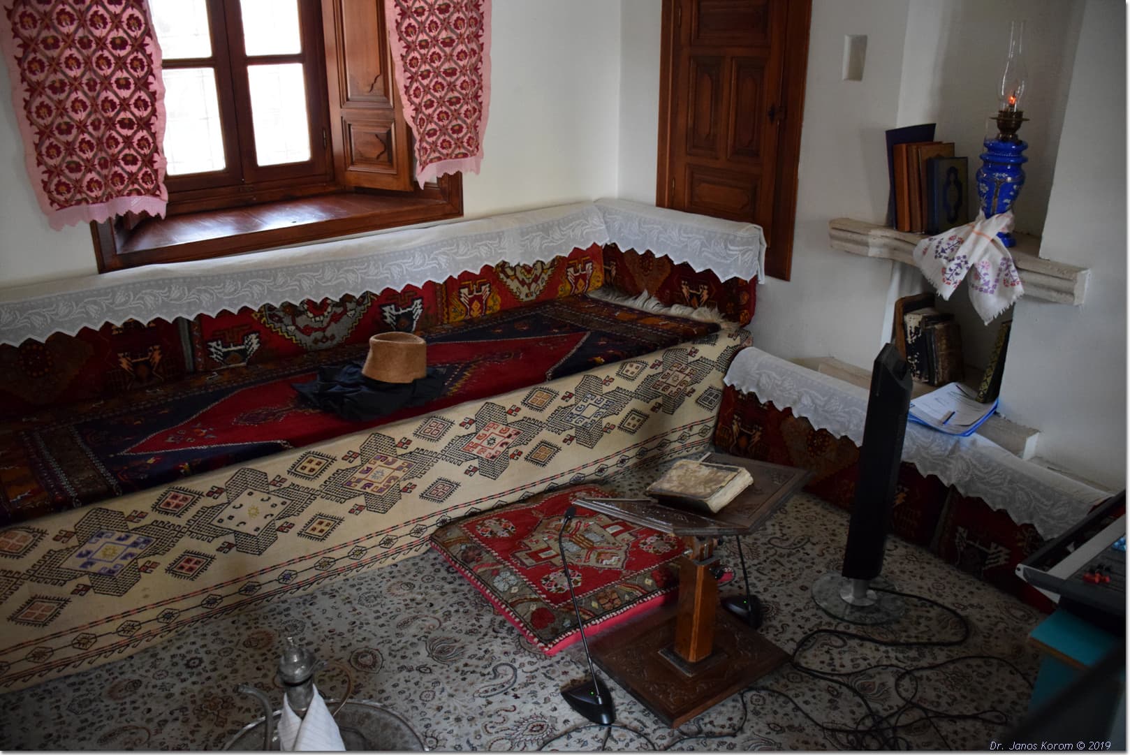 Dervish-cell exhibit with life-size mannequins recreating Mevlevi lodge daily life.