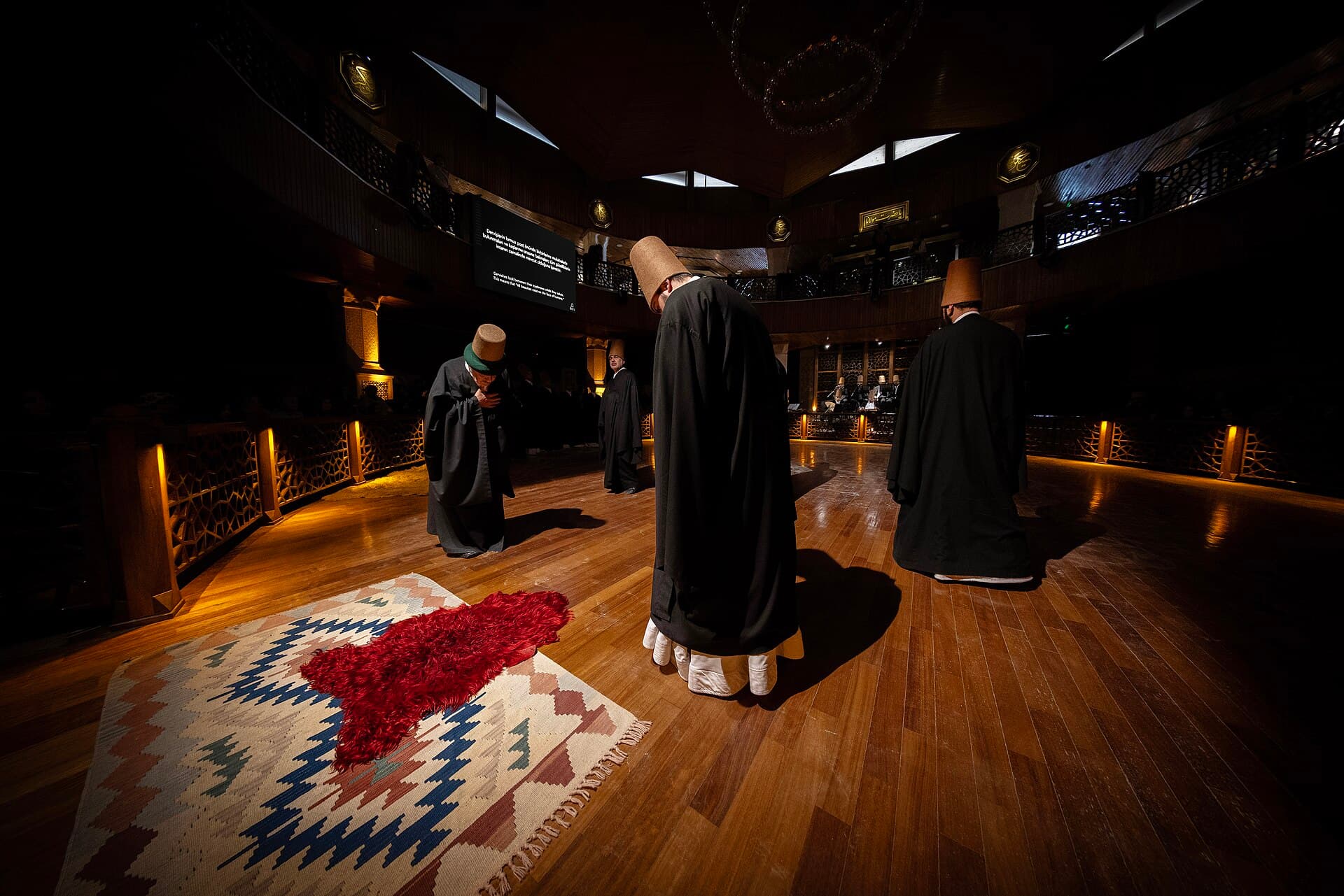 Whirling dervishes in white tennure skirts perform the Mevlevi Sema ceremony in Konya.