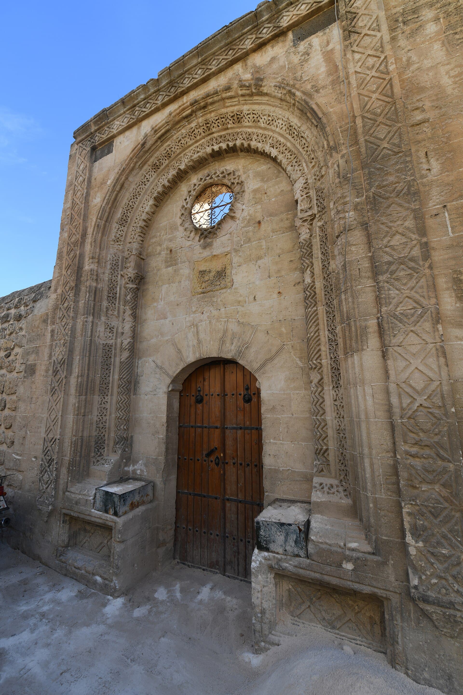 Ornate carved stone entrance portal of Kırklar Kilisesi church in Mardin.