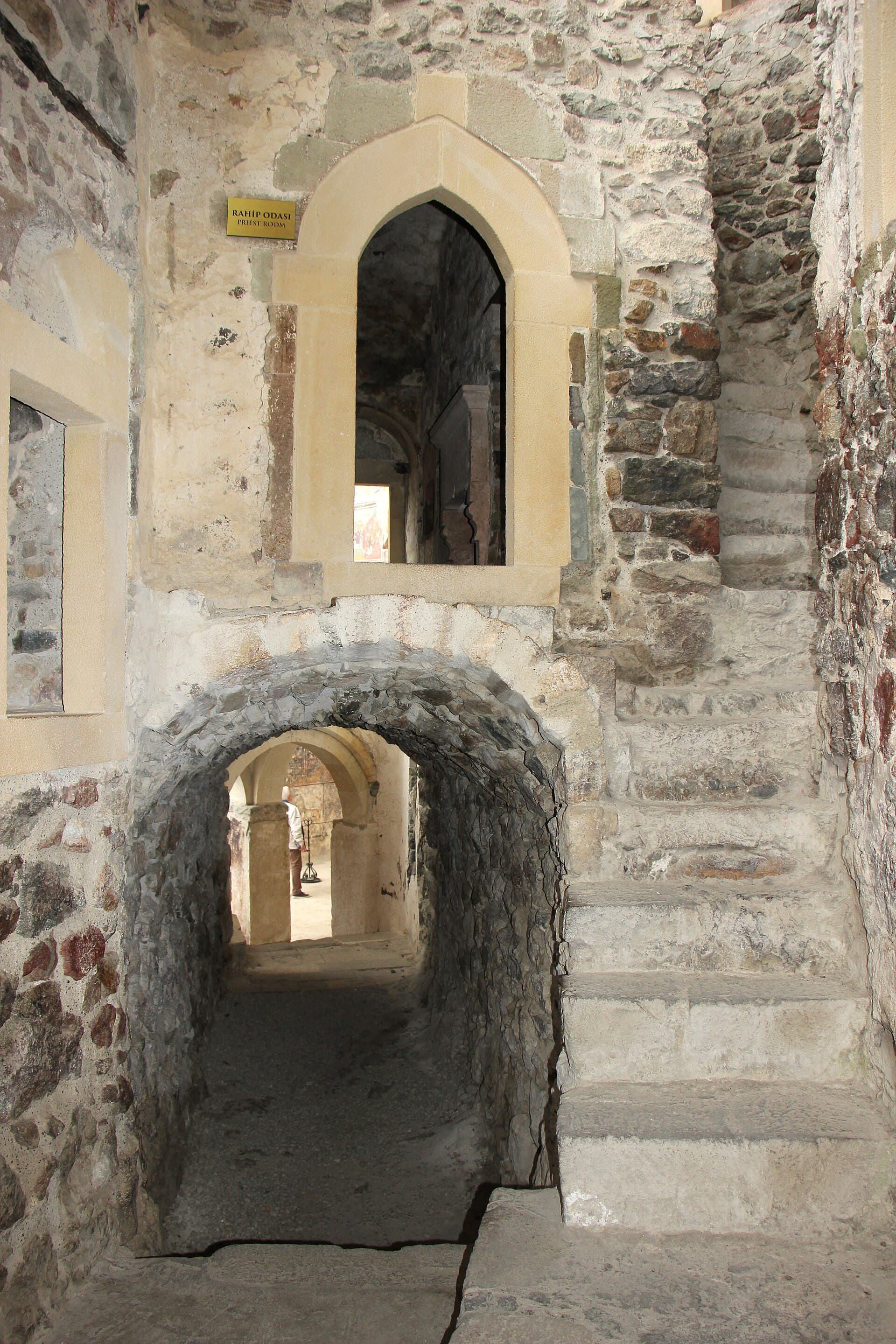 Stone stairway and archway inside a passage at Sümela Monastery's monks' quarters